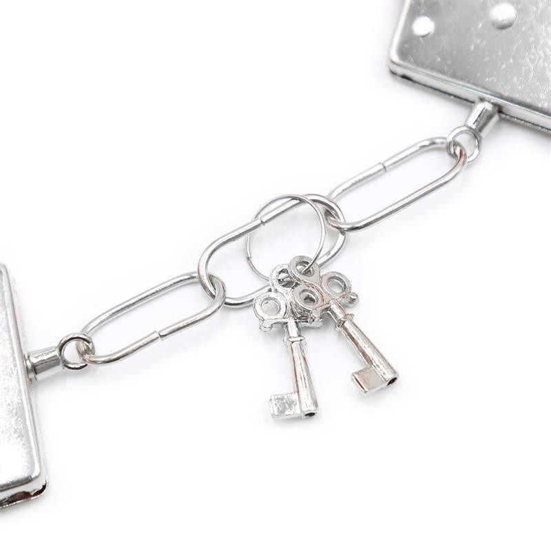 menottes en metal pour poignées avec franges rouge